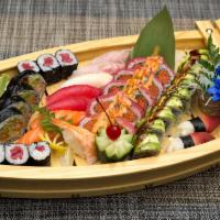 B16. Sushi and Sashimi Lover Boat · Ten pieces of sushi, 16 pieces of sashimi, one tuna roll, one shrimp tempura roll, one drago...