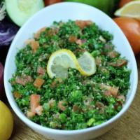 Tabbouleh Salad · Chopped parsley, mint, fresh tomatoes, green onions and bulgur wheat tossed in special house...