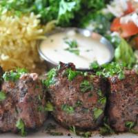 Lamb Shish Kebab · Finest cut of tender lamb cubes marinated in house spices, grilled to order served with basm...