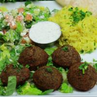 Falafel Platter · 5 crispy vegetarian patties crafted from chickpeas, fava beans, herbs and spices served with...
