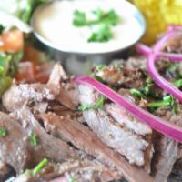 Beef Shawarma Platter · Thinly sliced top sirloin beef marinated in authentic house spices slowly roasted on vertica...