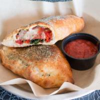 Build Your Own Calzone · Sandwiched-sized folded pizza with sauce on side and served with mozzarella and a choice of ...