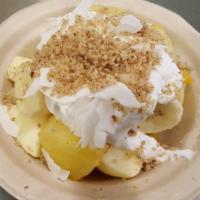 Tropical Fruit Bowl · Mango, pineapple, bananas. Topped with coconut flakes and crushed walnuts. Raw, vegan, glute...