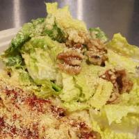 Caesar Salad with Tahini Dressing · Fresh chopped romaine lettuce, walnuts, tossed with paprika, garlic tahini dressing. Topped ...