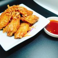 Wings · Chicken wing deep fried. Served with sweet and sour sauce.