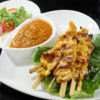 Chicken Satay · Marinated with a homemade sauce then grilled on skewers. Served with peanut sauce and cucumb...
