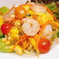 Papaya Corn Shrimp Salad · Contains Peanuts. Green papaya mixed with peanuts, corn, tomatoes, green beans, fresh lime j...