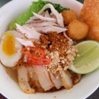 Noodles Tomyum Soup · Rice noodles soup with Thai homemade sauce, chicken breast, fish ball, fish cake, boiled egg...