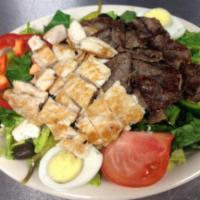 Colossal Salad · It's a meal! 4 oz. of fresh grilled chicken and 4 oz of. grilled gyro meat atop a bed of rom...