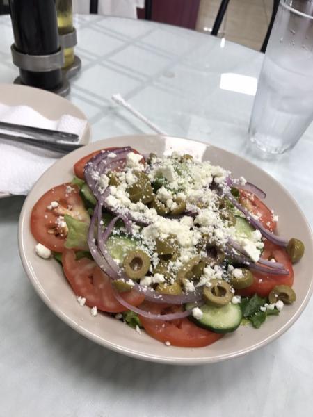 Greek Salad · Lettuce, green olives, red onions, cucumbers, tomatoes and feta cheese.