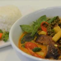 C6. Gang Phed · Roasted duck in red curry with pineapple, grape tomatoes, bell pepper, hot pepper, coconut m...