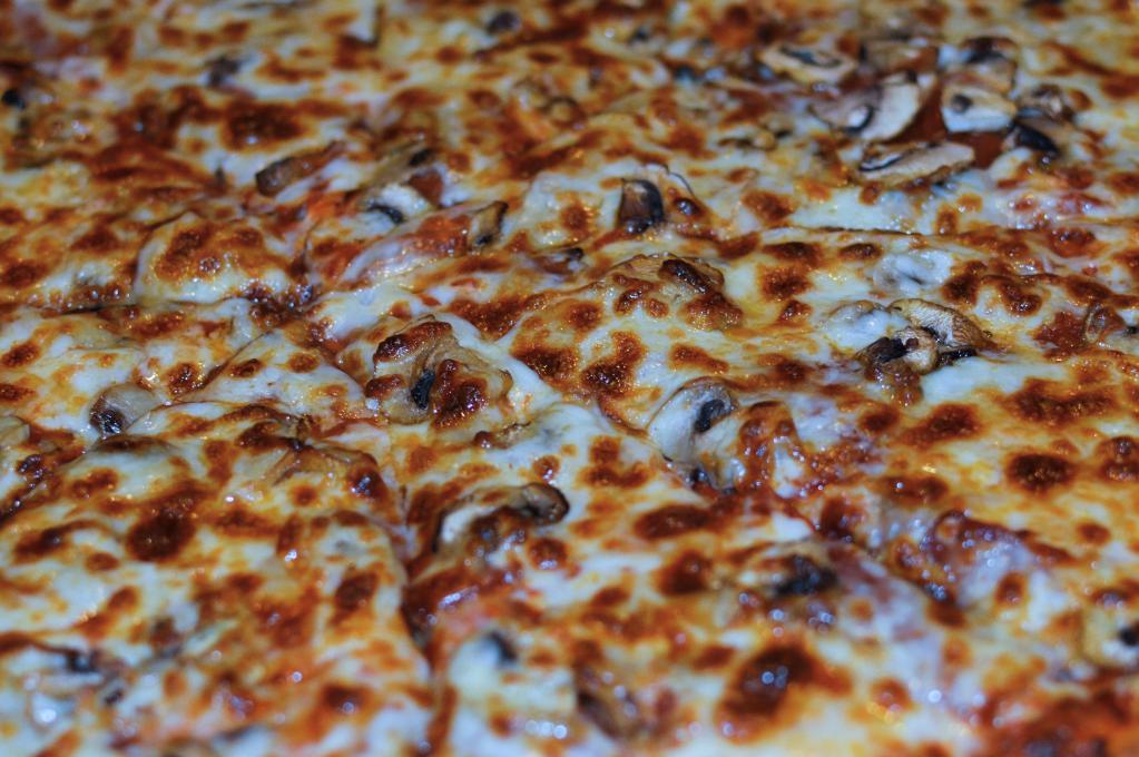 Veggie Classic · Olives, bell peppers, onions, mushrooms, tomatoes, mozzarella cheese and cheddar cheese.