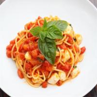 Spaghetti Crudaiola · Tomato sauce, diced tomatoes, mozzarella fior di latte, and fresh basil.