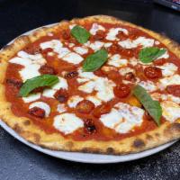 Piola Pizza · Mozzarella fior di latte topped with roasted cherry tomatoes and fresh basil.