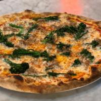 Malamocco Pizza · Tomato sauce, mozzarella, sautéed broccolini, and Italian sausage.