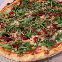 Castello Pizza · Tomatoes sauce, mozzarella, ground beef, gorgonzola, sweet peppers, arugula, and balsamic gl...