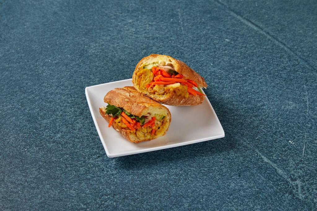 Curry Chicken Sandwich · Sweet baguette, carrots, daikon, red onion, English cucumber, cilantro, jalapeno and aioli.