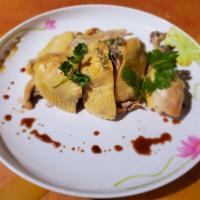 Hainanese Chicken · Steamed chicken served room temperature along with Chef's soy sauce.
