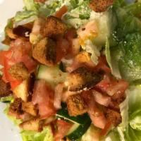 House Salad · Romaine lettuce with tomatoes, cucumbers, croutons and Parmesan served with our house dressi...
