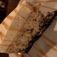 Cookies & Cream Cheesecake · Classic Cheesecake Loaded w/ Chocolate Cookie Sandwich Pieces on a Rich Chocolate Cookie Cru...