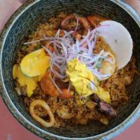 Arroz con Mariscos · Seafood combined with squid, shrimp, scallops, octopus and mussels, mixed with rice, peppers...
