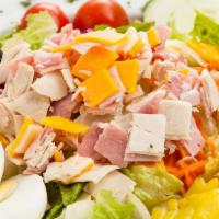 Cobb Salad · Chopped turkey on a bed of lettuce with tomatoes, avocado, bleu cheese crumbles, chopped egg...