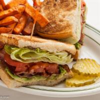 B.L.T. Sandwich · Bacon, lettuce, and tomato on sourdough. Served with your choice of side. Add avocado for ad...