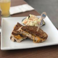 Tuna Melt · Grilled albacore tuna salad with cheddar cheese on rye. Served with your choice of side.