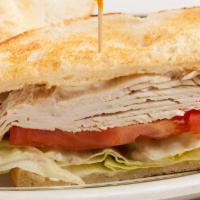 Fresh Turkey Breast Sandwich · Lettuce, mayo and tomato piled high on sourdough. Served with your choice of side and pickles.