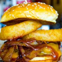 Western Burger · BBQ sauce, cheddar cheese, Applewood bacon and crisp onion rings.
