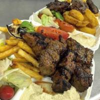 Lamb Kabob Dinner · Served with pita bread, house salad and your choice of side and spread. 