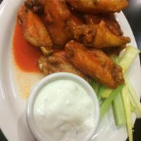 10 Piece Buffalo Wings · Served with bleu cheese and celery.