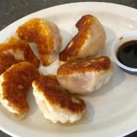 6 Pieces Homemade Potstickers · Plump pan fried pork dumplings.