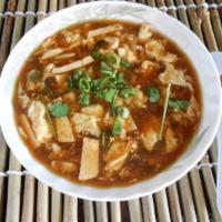 Hot and Sour Soup · Spicy soup with chicken, tofu, egg, and carrots