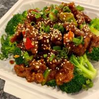 Spicy Szechuan Beef · Hand battered crispy beef cartelized in a sweet spicy sauce on bed of broccoli