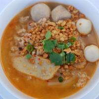 N2. Tom Yum Noodle Soup · Rice noodles, pork ball, fish ball, fish cake, ground chicken, sprout, peanut, green onion, ...