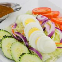 S1. Thai Salad · Lettuce, cucumber, tomatoes, red onion, shredded carrot and cabbage, boiled egg and peanut d...