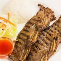 B3. BBQ Beef Ribs · Marinated with special brown sauce, salad and rice.