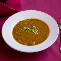Dal Makhani · Delicately spiced and gently simmered black lentil.