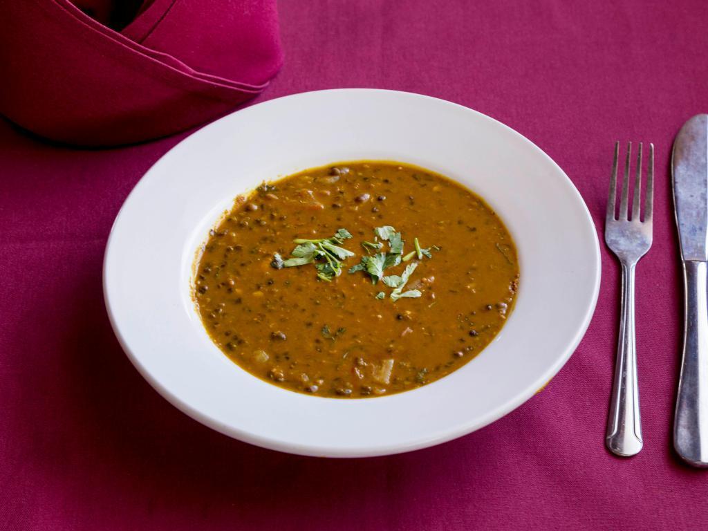 Dal Makhani · Delicately spiced and gently simmered black lentil.