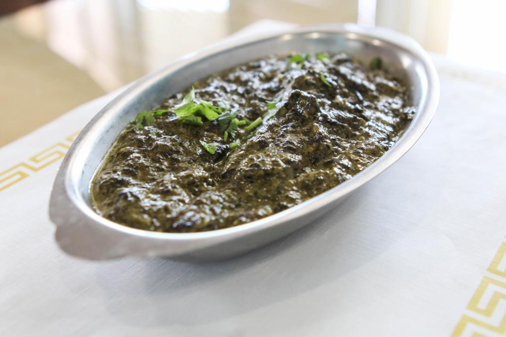 Chicken Saag · Boneless chicken pieces cooked in a creamy spinach puree and fresh herbs.