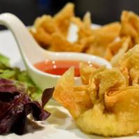 Crab Wontons · Crispy-fried wontons stuffed with a combination of imitation crab meat and cream cheese. Ser...