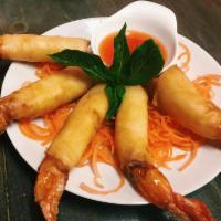 A11. Rocket Shrimp · Fried wrapped shrimp with rice paper served with sweet roll sauce.