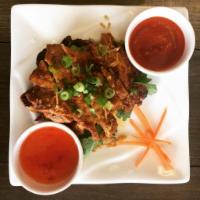 A16. BBQ Pork · Grilled marinated pork served with Thai chili sauce.