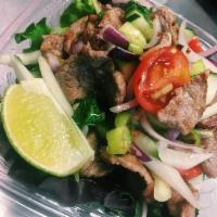 Sa5. Spicy Grilled Beef Salad · Grilled beef, scallion, red onion, tomato and Thai fresh chili in lime dressing.