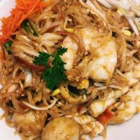 N1. Pad Thai · Thin rice noodle, egg, scallion, bean curd, bean sprout and crushed peanut in tamarind sauce.
