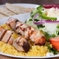 Salmon Skewers Light Meal · Souvlaki. 2 char-grilled salmon skewers over rice with a Greek salad.