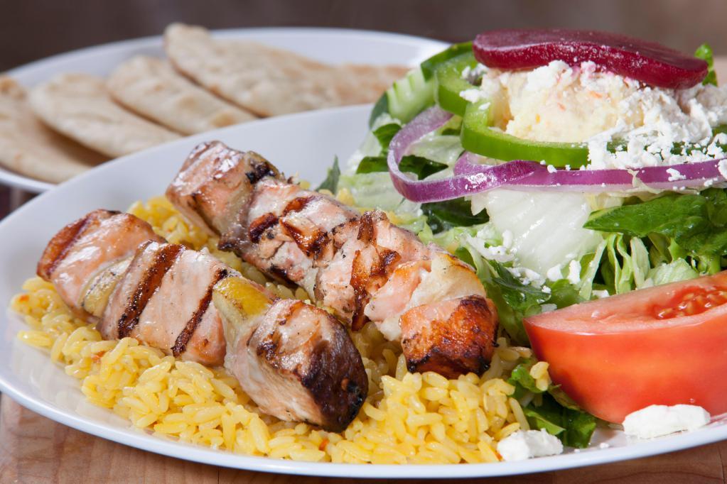 Salmon Skewers Light Meal · Souvlaki. 2 char-grilled salmon skewers over rice with a Greek salad.