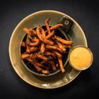 Sweet Potato Fries · Hand cut sweet potatoes, roasted and flash fried, seasoned with Moroccan spices and a hint o...