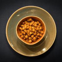 Roasted Garbanzos · Crisp roasted chickpeas tossed in Mediterranean spices